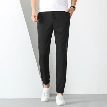 Весенние модные повседневные брюки-стрейч 2021, мужские серые эластичные брюки в корейском стиле, черные свободные удобные уютные брюки большого размера